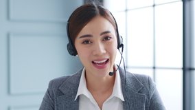 POV Young Asian businesswoman, call center, customer service talking on video call conference or virtual meeting in office, front view, look at camera - Powered by Shutterstock - Get 15% off with code: PIKWIZARD15
