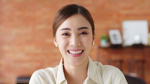 Portrait young beautiful Asian business woman in casual suit look at camera and smile