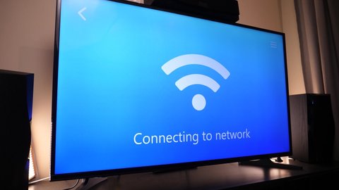 Smart TV connecting to the wi-fi network to be able to get the Internet and use the smart features.