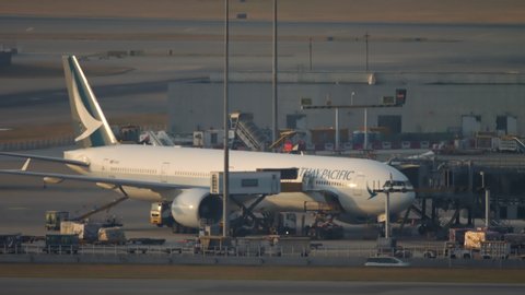 HONG KONG - NOVEMBER 07, 2019: Cathay Pacific Boeing 777 unloading at the terminal after arrival to Chek Lap Kok International Airport, Hong Kong