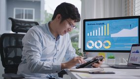 Young attractive asian thai man busy work multiple screen computer or smart tablet on table desk at home in freelance data analyst, data science scientist for business. - Powered by Shutterstock - Get 15% off with code: PIKWIZARD15