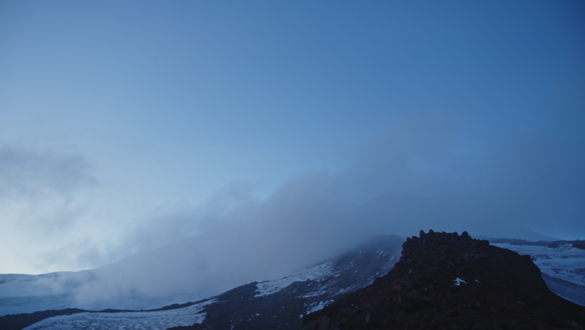 Timelapse of Mount Elbrus with a cap of clouds.
