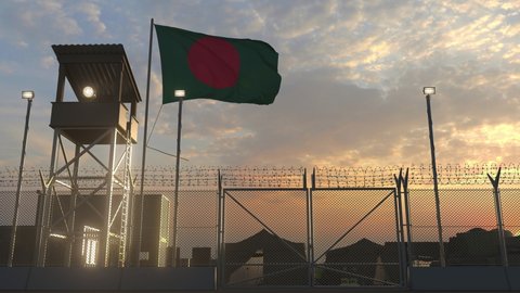 Waving flag of Bangladesh above military base in the evening