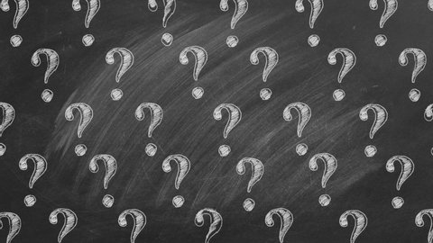 Question marks in chalk on a blackboard. Ask for help. FAQ concept. Asking questions.