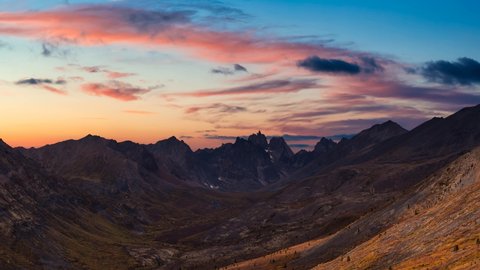 Cinemagraph Continuous Loop Animation. Aerial View of Scenic Landscape and Mountains in Canadian Nature. Colorful Twilight Sky Artistic Render. Taken in Tombstone Territorial Park, Yukon, Canada.