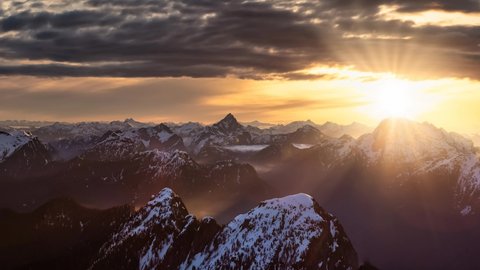 Cinemagraph Continuous Loop Animation. Aerial Panoramic View of Remote Canadian Mountain Landscape. Dramatic Colorful Sunrise Art Render. Located near Vancouver, British Columbia, Canada.
