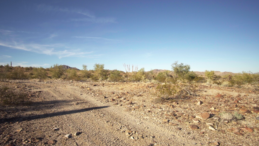Quad 4x4 atv passing at a dirt road at Quartzsite, AZ, USA. Royalty-Free Stock Footage #1063131613