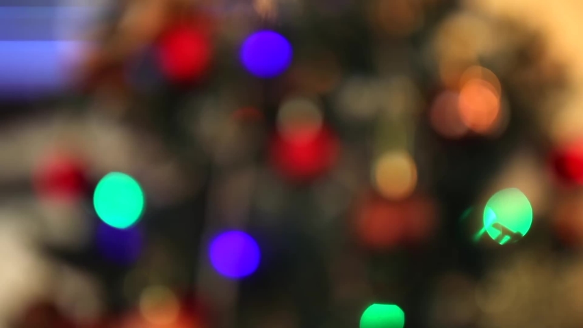 New Year's theme. Shot out of focus. New Year's unnie shimmer on the New Year tree | Shutterstock HD Video #1063136857