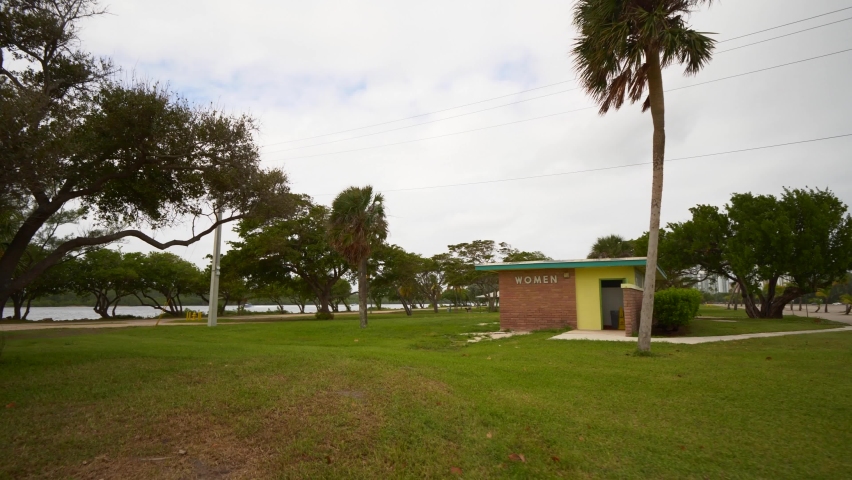 Old building public restrooms in the park 4k 60p