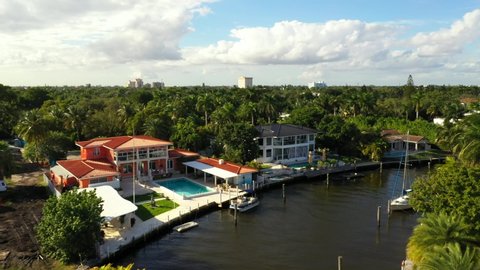 Aerial tour Miami real estate waterfront on canal