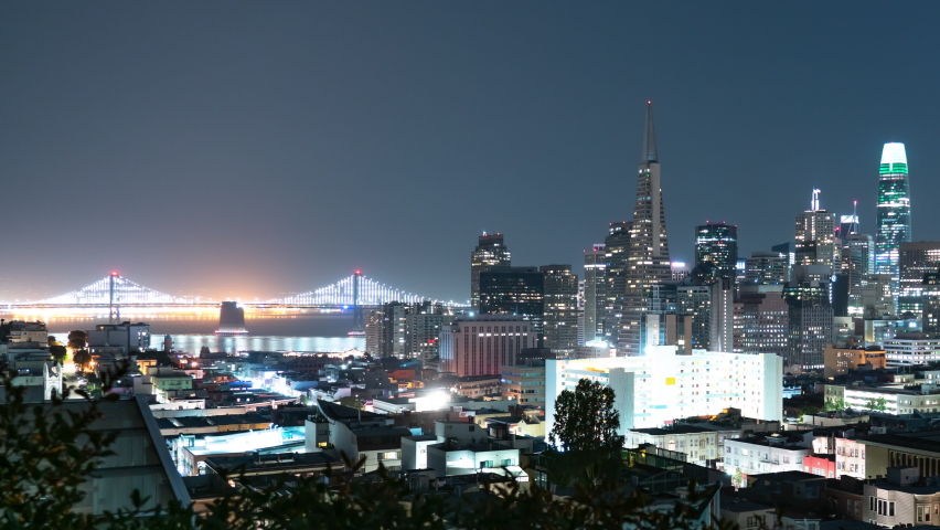 San Francisco Financial District Skyline and Bay Bridge from Russian Hill Night Time Lapse California USA