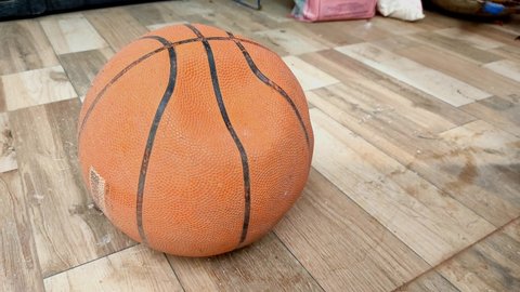 Close up of old used punchered basketball