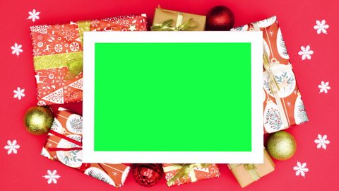 6k Christmas gifts and ornaments around frame with green screen. Stop motion