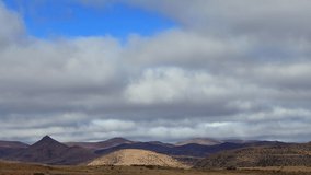 Time lapse of clouds over the mountains and grassland, Mountain Zebra National Park, South Africa