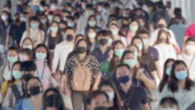 4K UHD resolution Blurred defocused view of Concept of crowds of Asian people wearing face protection walking at work in early morning,Concept of coronavirus quarantine, COVID-19, new normal concept  - Powered by Shutterstock - Get 15% off with code: PIKWIZARD15