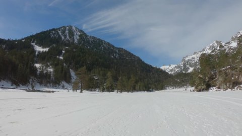 PAN SLOW MOTION SHOT - The Valley of Marcadau in winter. The heart of the ski station of Pont d’Espagne, Pyrenees National Park, Hautes-Pyrénées department, Occitanie, France.
