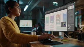 Young Latina Designer Working on a Desktop Computer in Creative Office. Beautiful Diverse Multiethnic Female is Developing a New App Design and User Interface in a Digital Graphics Editing Software. - Powered by Shutterstock - Get 15% off with code: PIKWIZARD15