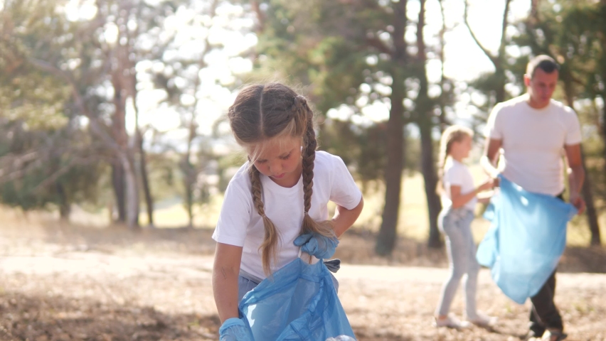 kid collecting trash volunteer teamwork. child group happy family on collects garbage plastic trash waste bottles trash. environmental happy family a ecology teamwork volunteer awareness pollution Royalty-Free Stock Footage #1063173430