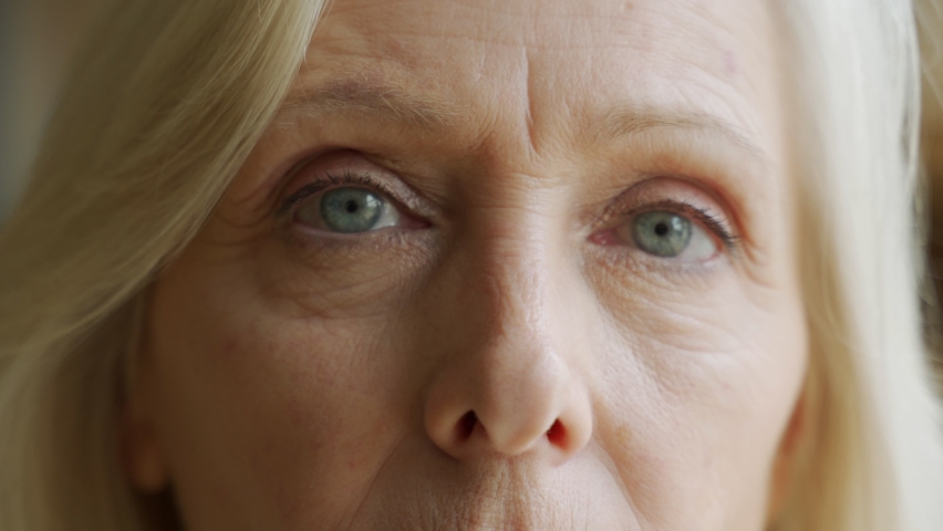 The face and eyes of the old woman. Large wrinkles on the old woman's face. Face close up Royalty-Free Stock Footage #1063173814