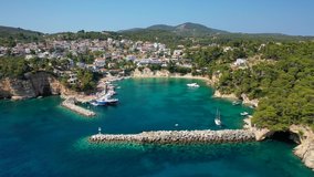 Aerial drone video of famous small fishing port and village of Votsi in island of Alonissos, Sporades, Greece