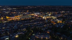 Aerial View Shot of London suburbs UK, beautiful Wimbledon High Street, United Kingdom at nigh evening
