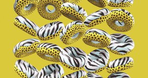 Minimal motion design. 3d creative animal prints donuts on yellow background. Fast food concept art. 4k video