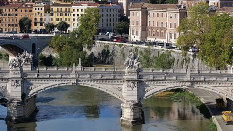 City of Rome cityscape in Italy, zoom out from the Ponte Vittorio Emanuele II bridge on Tiber river
