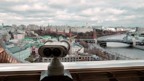 Observation deck opposite the Moscow Kremlin. Powerful binoculars for observing the Moscow Kremlin and other sights of Moscow city center. Kremlin surveillance. Big Brother is watching the Kremlin