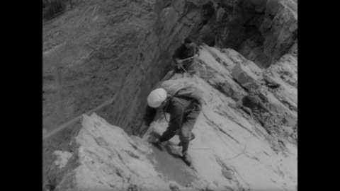 CIRCA 1963 - A mountain climbing class takes place in the Canadian Rockies.