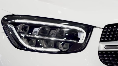 New white modern car front led headlight and radiator grille.