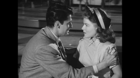 CIRCA 1949 - In this drama film, a woman faints at the sight of dizzying carousel lights on a date with her boyfriend.