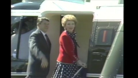 CIRCA 1982 - President Reagan and Nancy Reagan board a helicopter that takes them past the Washington Monument, then disembark Air Force One.