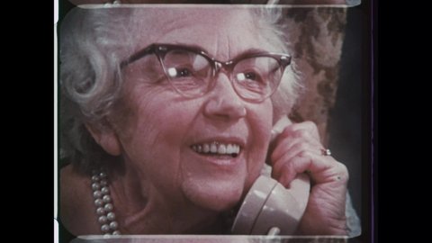 1970s Atlanta, GA. Bell South Commercial TV Ad. Elderly Grandma talking on a Rotary Phone.  4K Overscan of 16mm Film from Vintage Television Commercial Advertisement