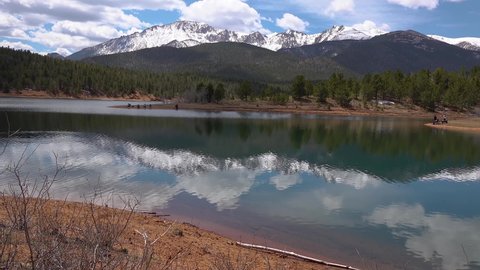 Reflection of snow-capped mountains in the water of the lake, Pikes Peak Mountains in Colorado Spring,  USA