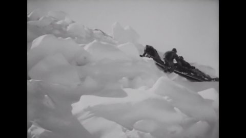 CIRCA 1922 - In this silent documentary, an Inuit hunting party gets underway on the ice fields with sled dogs.