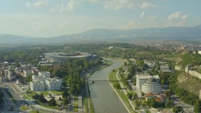 Drone video of the Todor Proeski National Arena stadium in Skopje where you can see the risk of houses, the city center and the mountains with the landscape in the background. Aerial view of Skopje Ma