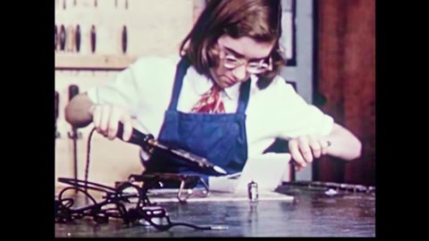 CIRCA 1950s - Boys excel in a ceramic class and a girl is the star student in an electrical workshop in the 1950s.