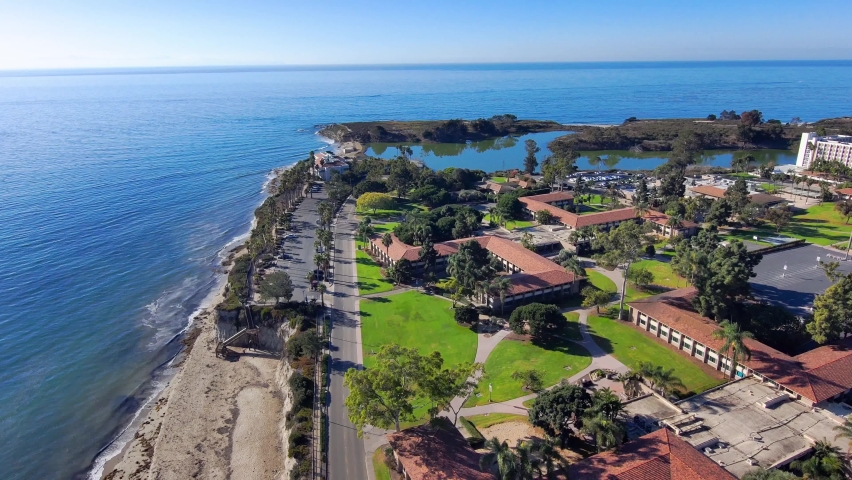 SANTA BARBARA, CALIFORNIA - CIRCA 2020 - Aerial of the University of California Santa Barbara UCSB college campus, along beach and lagoon. Royalty-Free Stock Footage #1063198237