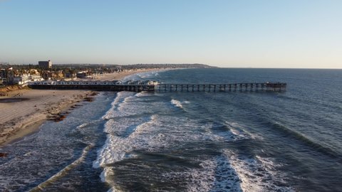 SAN DIEGO, CALIFORNIA - CIRCA 2020 - Aerial over surfers at Crystal Pier, San Diego, California.
