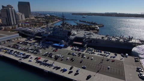 SAN DIEGO, CALIFORNIA - CIRCA 2020 - Orbiting aerial of the U.S.S. Midway Navy aircraft carrier museum in San Diego harbor, California.