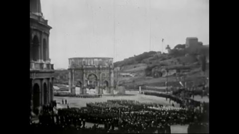 CIRCA 1930s - Scenes of Mussolini overseeing a rally in Rome as well as military production in a 1936 newsreel.