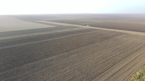 Dramatic wide sweeping views of large scale industrial farm lands - Drone footage.