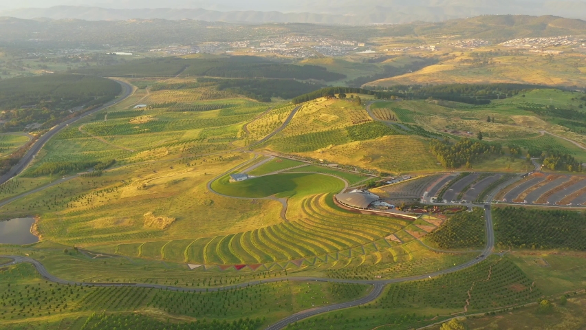 Aerial view of the national arboretum in Canberra, the Capital City of Australia in the early morning showing the Margaret Whitlam Pavilion and The Conservatory  