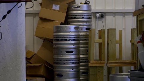 London, UK - Dec 01 2020, Pub Lockdown - Steel kegs in craft beer bar being stacked 4k 