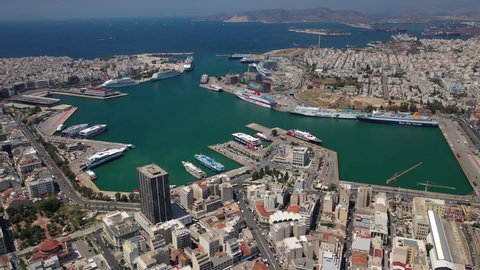 Aerial drone panoramic video of famous passenger port and town of Piraeus, Attica, Greece