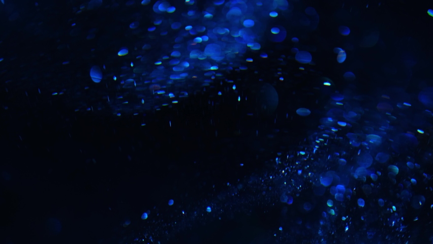 Particles blue cinematic concert black background