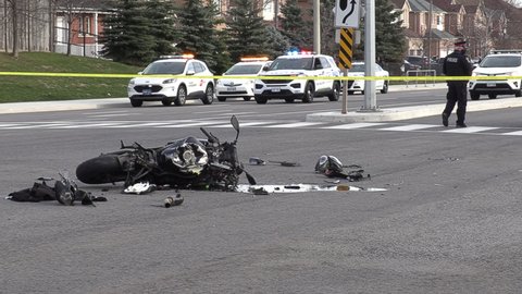 Mississauga, Ontario, Canada December 2020 Police at scene of motorcycle crash in city intersection