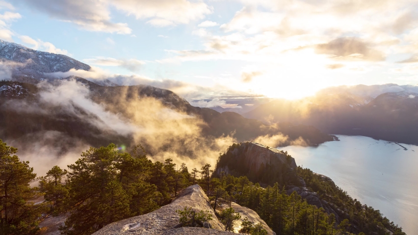 Time Lapse of dramatic colorful sunset in the Canadian Nature. Taken from Chief Mountain, in Squamish near Vancouver, British Columbia, Canada.