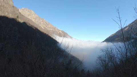 PAN SHOT - The upper Neste d'Oo valley widens in the Val d'Astau, just downstream from a chain of magnificent mountain lakes. Valley near Granges d'Astau in the French Pyrenees. 
