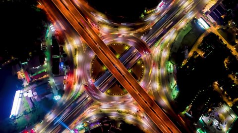 Aerial movement hyperlapse of traffic at night in Bangkok city.